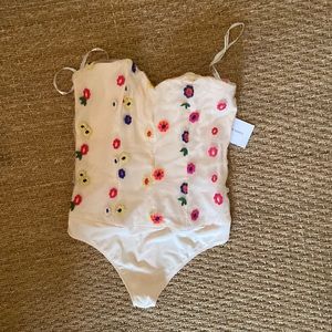 Brand new with tags. Lovers and friends bodysuit. Size small